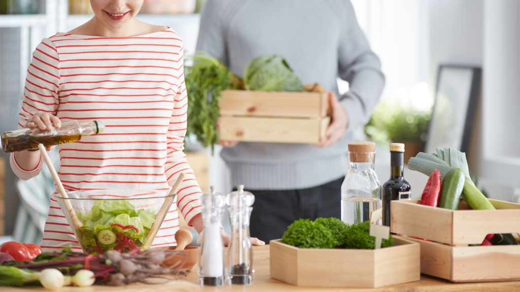 a woman holding a bag of food