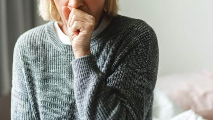 A woman coughing