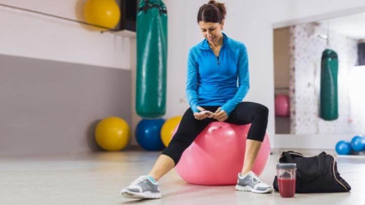 Woman with a smoothie after her workout