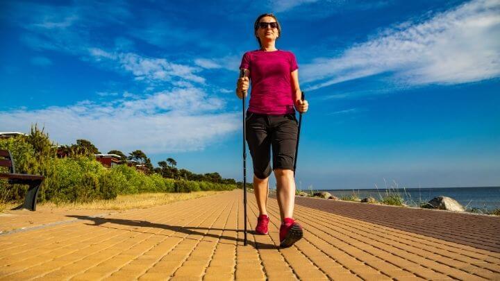 Healthy middle aged woman briskly walking