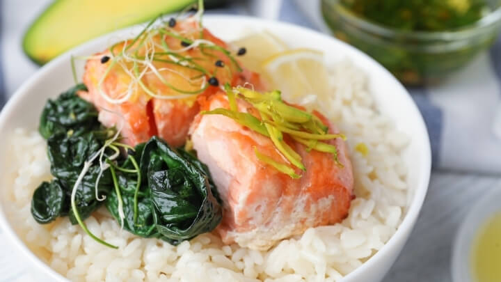 Baked salmon and spinach over rice