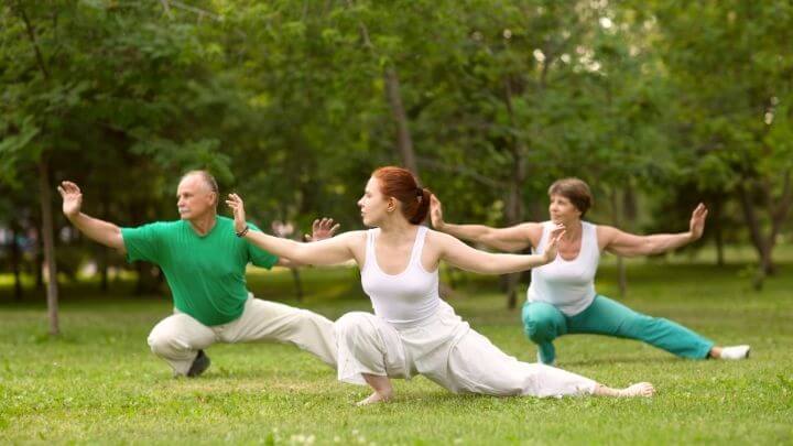 People doing tai chi in the park