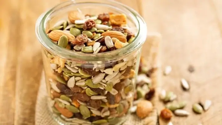 Nuts and seeds in a small glass jar