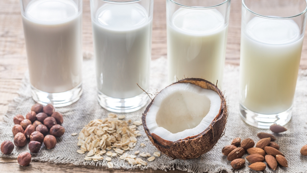 a group of glasses with milk and nuts