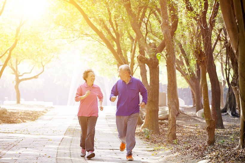 Senior couple jogging in the park