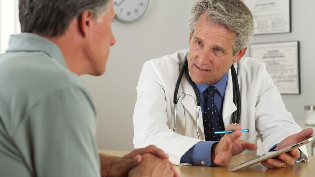 A doctor advising his patient