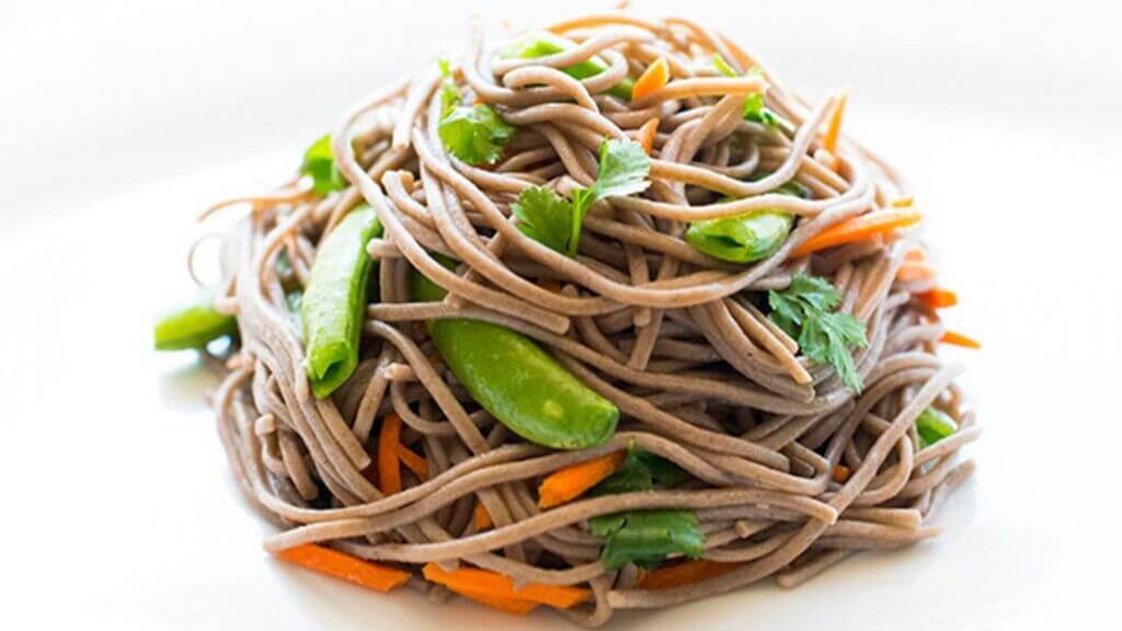 a bowl of noodles with vegetables