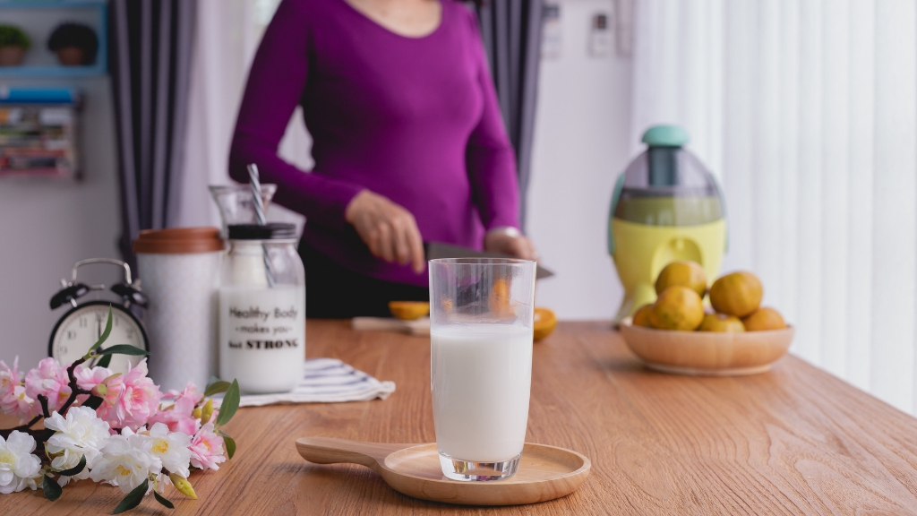 I drink milk for breakfast. Milk on Table.