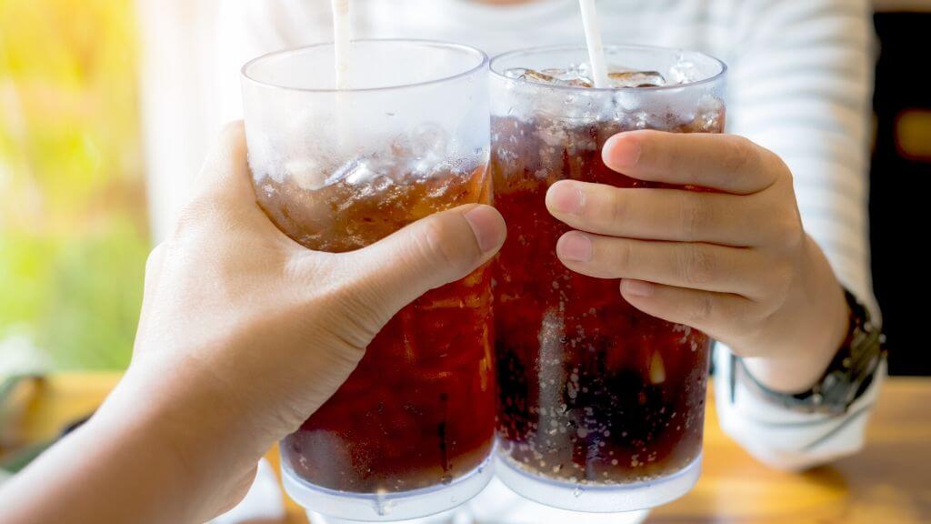 Friends cheering with diet soda