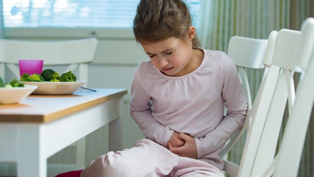 a girl sitting on a chair