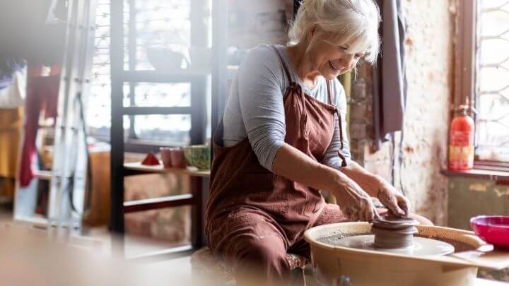 Healthy older woman working at her studio