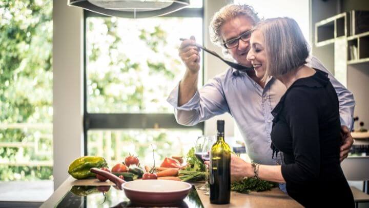 A couple cooking a healthy meal at home