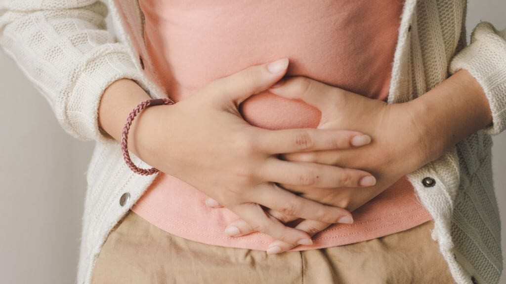 a close-up of a person holding a baby's hand