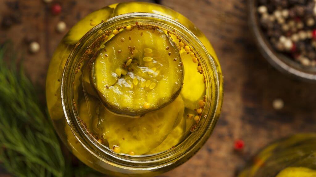 Pickled cucumbers in glass jar