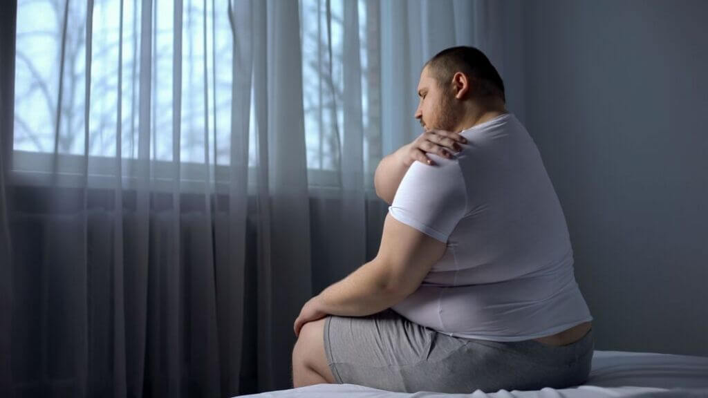 a person sitting on a bed