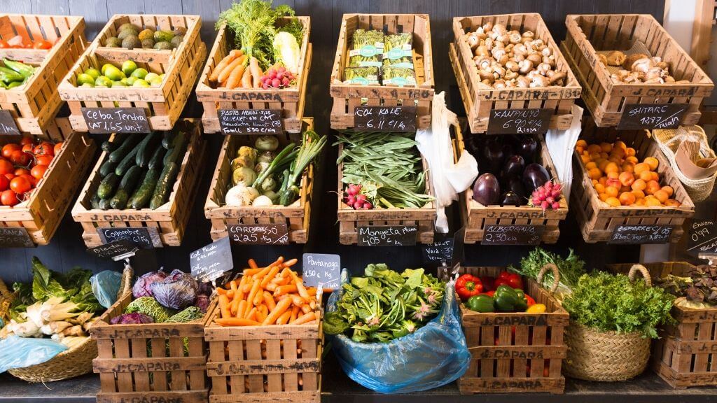 a group of baskets full of vegetables