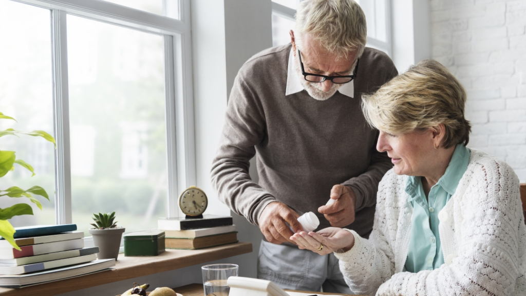 a man and a woman looking at a phone