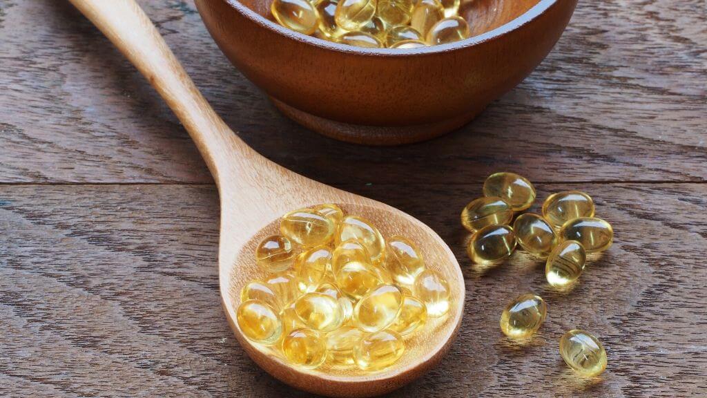 Fish oil in a wooden spoon