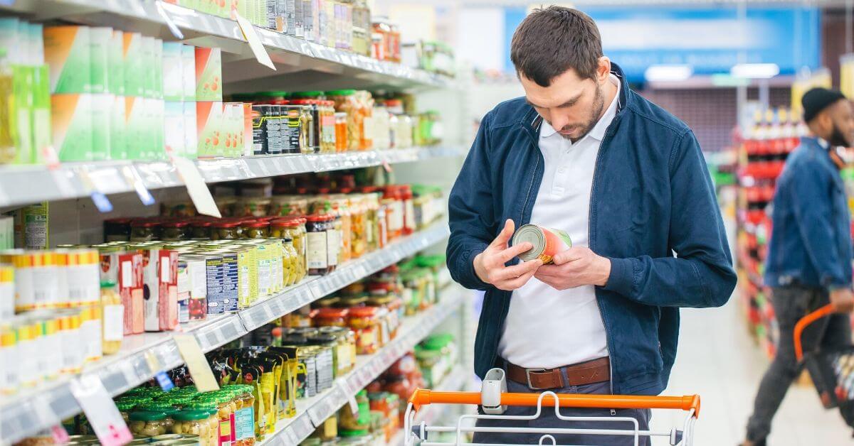 Man reading nutritional facts in the grocery market