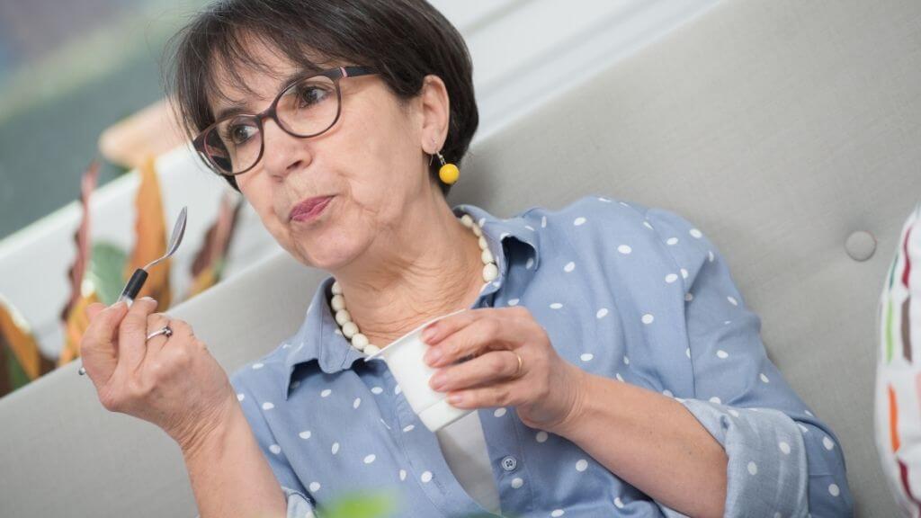 Senior woman enjoying some yogurt