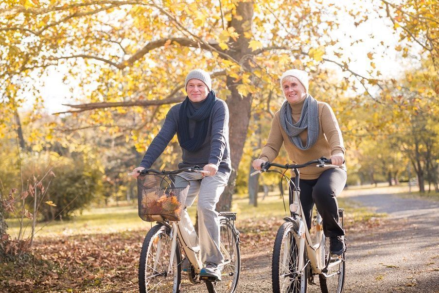 A couple on their bikes in the park