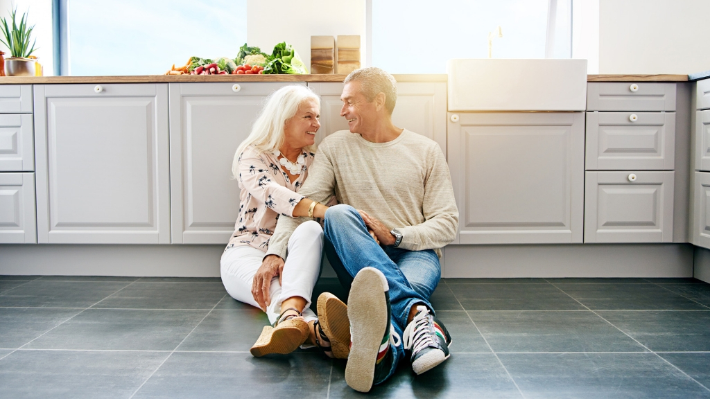 a man and a woman sitting on the floor