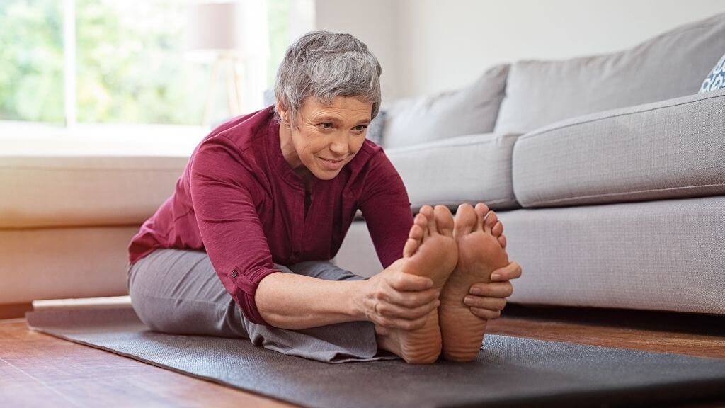 Woman stretching at home