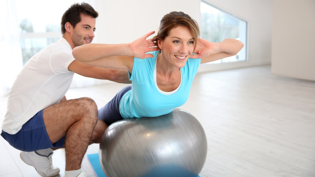 a man and a woman exercising