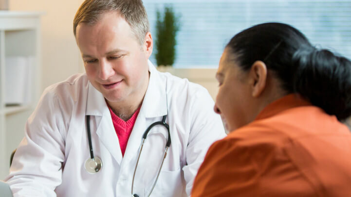 A woman talking to her doctor