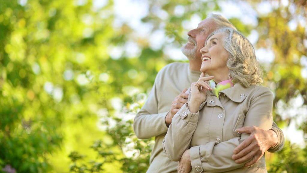 Happy older couple enjoying outdoors