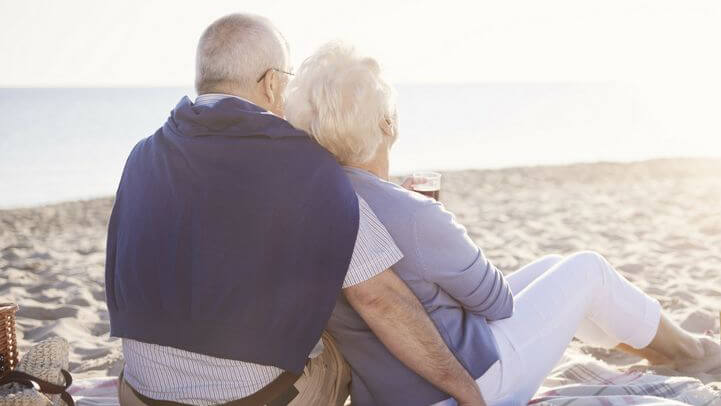 a couple sitting at the beach