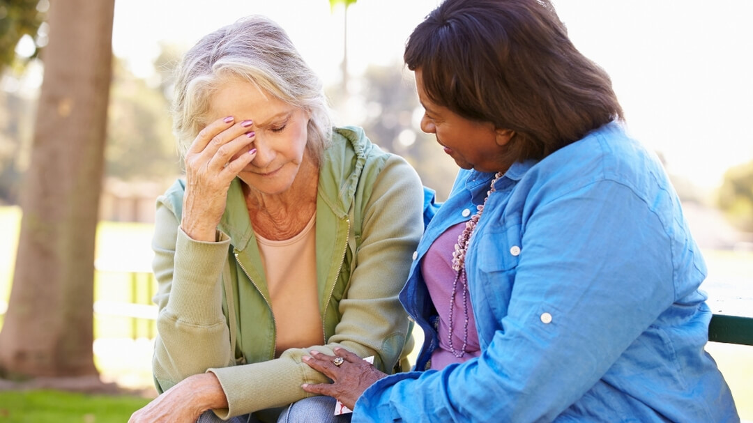 A woman consoling her friend