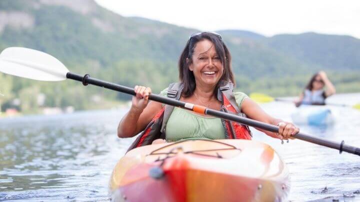 A middle aged woman on a kayak