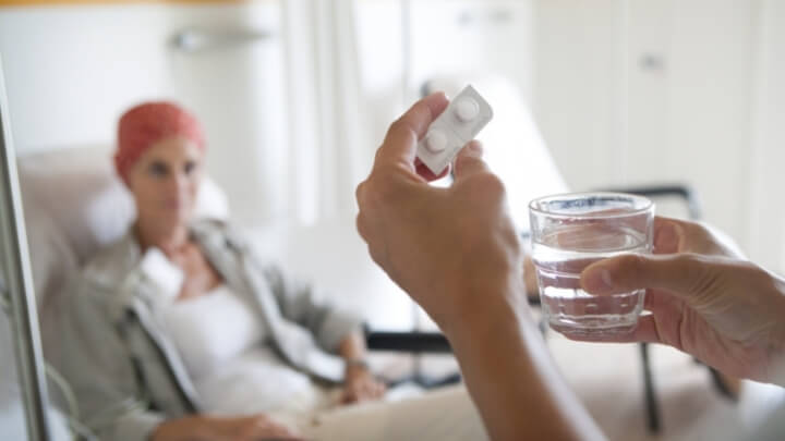 A patient about to take her pills