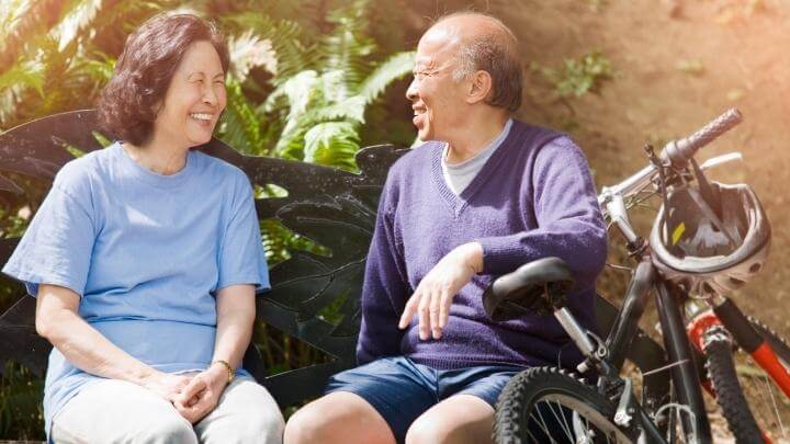 Older couple chat after bike riding