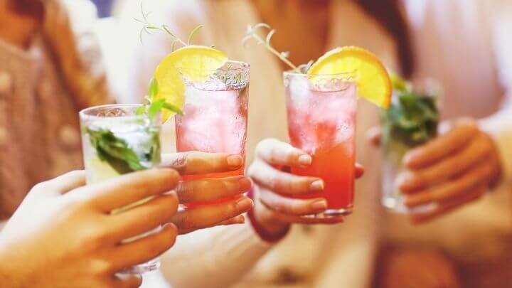 Women cheering with cocktails