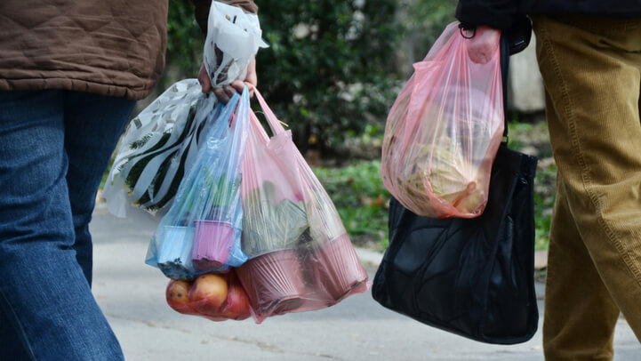 Shoppers carrying plastic bags