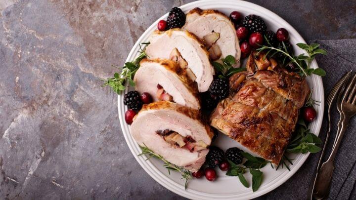 Apple stuffed roasted pork with berries