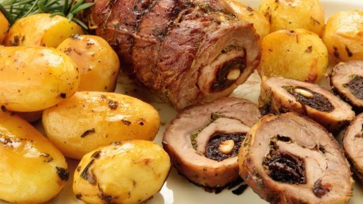 Stuffed pork roast with roasted rosemary potatoes