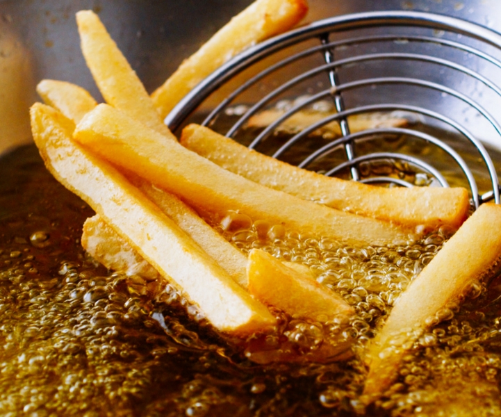 Potatoes frying in oil