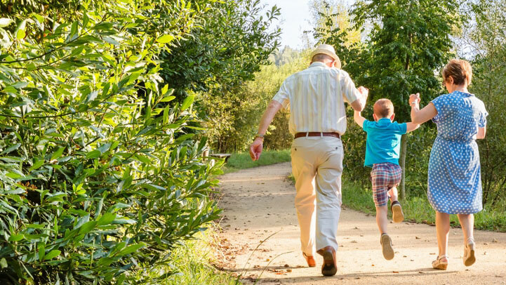 A happy family taking a stroll in the park