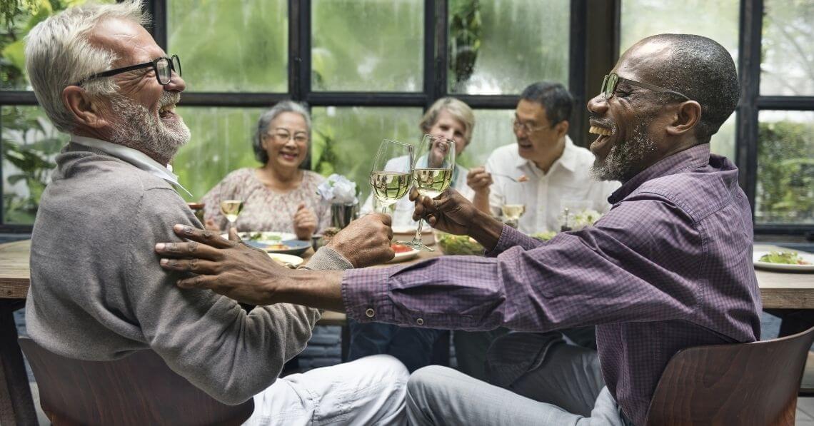 Senior friends enjoying dinner