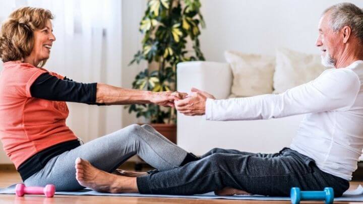 Older couple working out at home