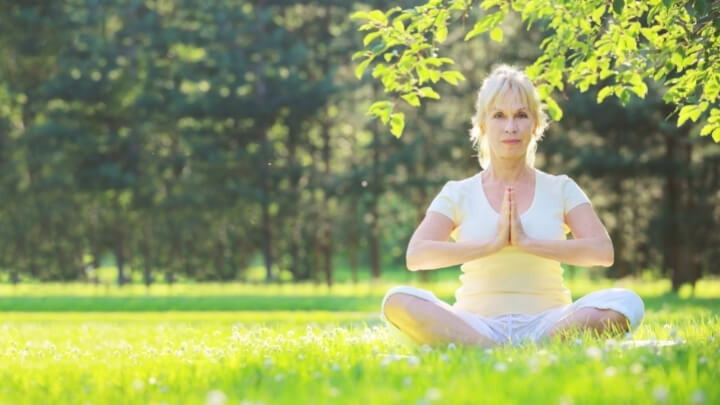 Woman doing yoga at the park