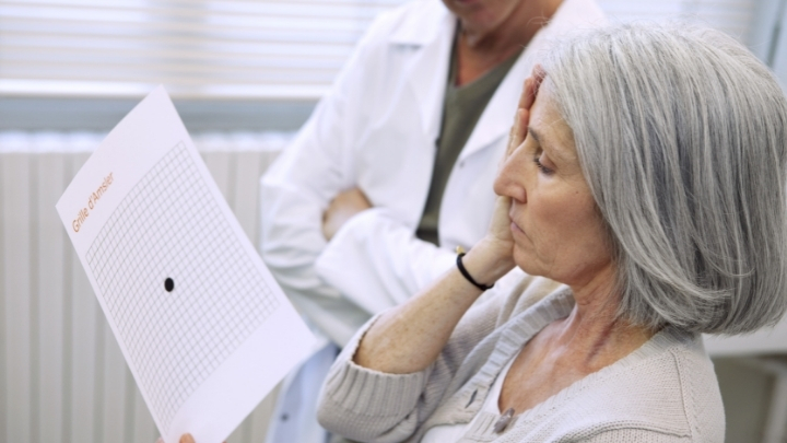 Woman taking Amsler grid eye test