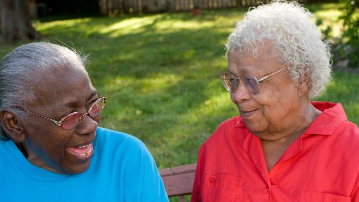 2 elderly ladies laughing