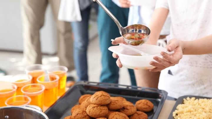 Homeless people being served food