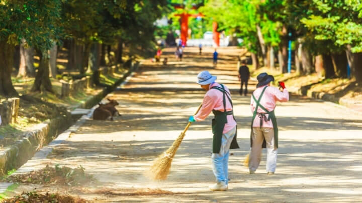 Volunteers sweeping the streets