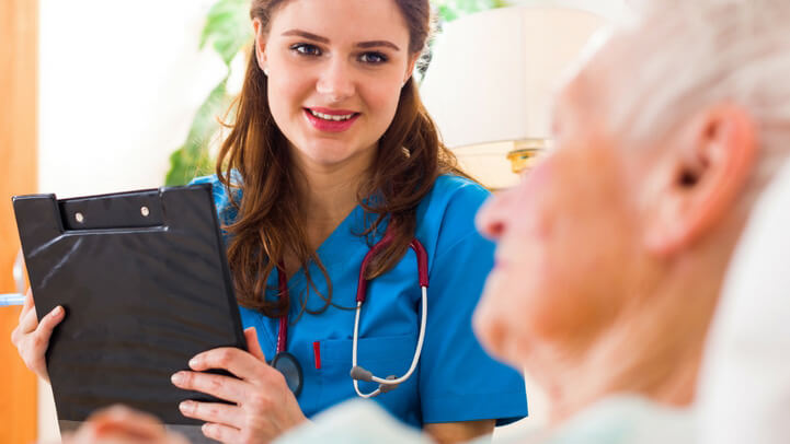 A nurse speaking with a patient recovering from stroke