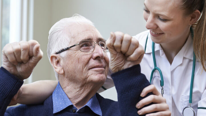 A doctor helping a patient recovering from stroke